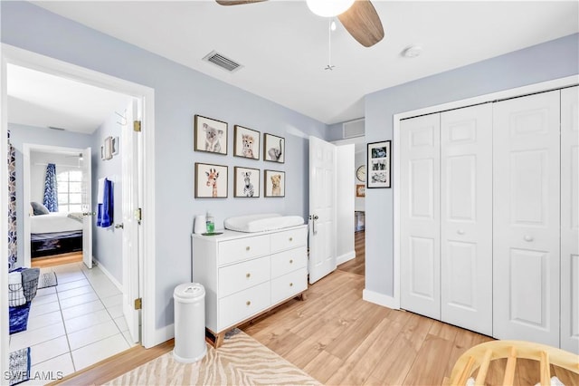 11741 Red Hibiscus Dr, Bonita Springs, FL 34135 - bedroom featuring light wood-type flooring, visible vents, a closet, and baseboards