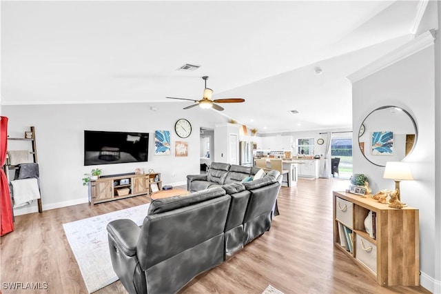 11741 Red Hibiscus Dr, Bonita Springs, FL 34135 - living area with ceiling fan, light wood-type flooring, ornamental molding, vaulted ceiling, and visible vents