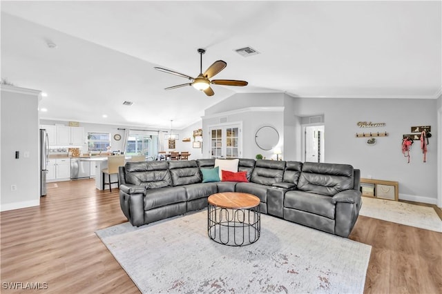 11741 Red Hibiscus Dr, Bonita Springs, FL 34135 - living room featuring baseboards, light wood-type flooring, vaulted ceiling, visible vents, and ceiling fan