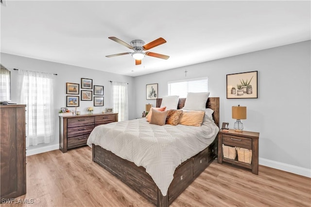 11741 Red Hibiscus Dr, Bonita Springs, FL 34135 - bedroom with light wood finished floors, baseboards, and a ceiling fan