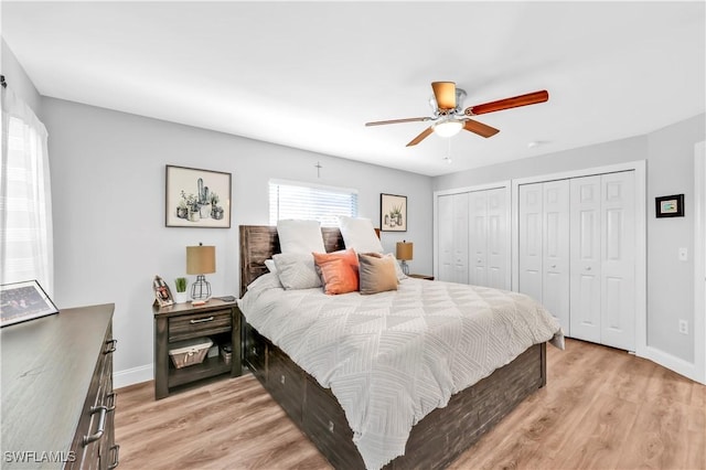 11741 Red Hibiscus Dr, Bonita Springs, FL 34135 - bedroom with multiple closets, light wood-type flooring, baseboards, and a ceiling fan