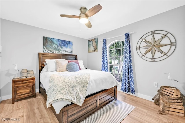 11741 Red Hibiscus Dr, Bonita Springs, FL 34135 - bedroom with light wood finished floors, ceiling fan, and baseboards