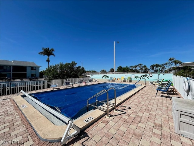 1206 SE 46th St Unit 1F, Cape Coral, FL 33904 - community pool featuring a patio