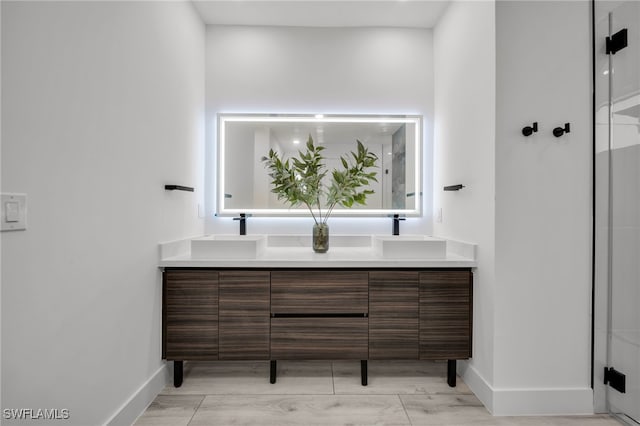 2138 SW 3rd Ave, Cape Coral, FL 33991 - full bathroom with double vanity and a shower with door
