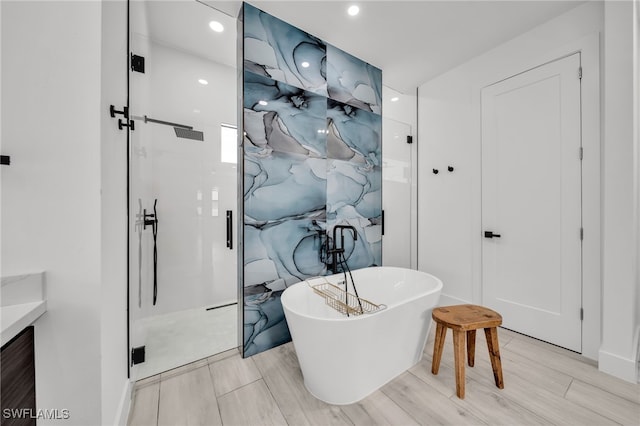 2138 SW 3rd Ave, Cape Coral, FL 33991 - full bath featuring a soaking tub, a stall shower, vanity, and recessed lighting