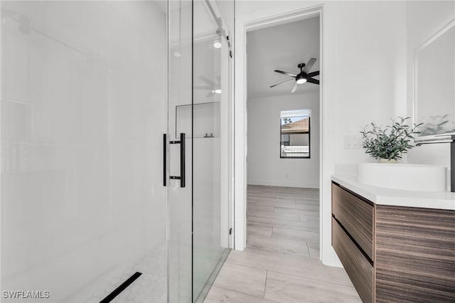 2138 SW 3rd Ave, Cape Coral, FL 33991 - full bathroom featuring a shower stall, ceiling fan, and vanity