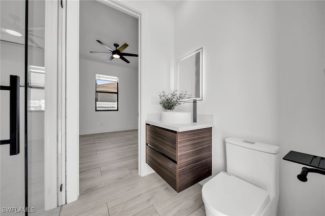 2138 SW 3rd Ave, Cape Coral, FL 33991 - bathroom with vanity, ceiling fan, and wood finished floors
