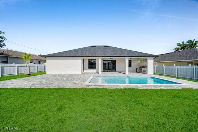 2138 SW 3rd Ave, Cape Coral, FL 33991 - back of house featuring a patio, a fenced backyard, a ceiling fan, stucco siding, and a shingled roof