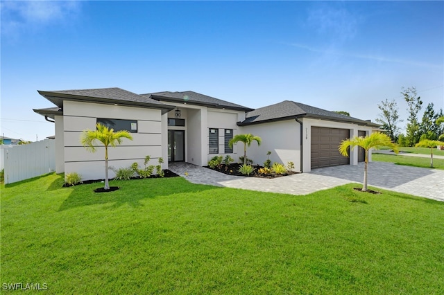 2138 SW 3rd Ave, Cape Coral, FL 33991 - prairie-style home with an attached garage, decorative driveway, and stucco siding