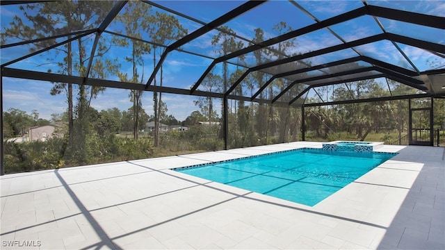 2343 Oil Well Rd, Naples, FL 34120 - view of pool featuring a patio area, a pool with connected hot tub, and a lanai