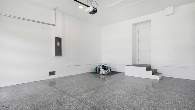 2343 Oil Well Rd, Naples, FL 34120 - garage featuring a garage door opener and electric panel