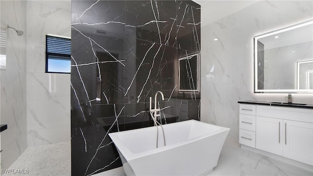 2343 Oil Well Rd, Naples, FL 34120 - bathroom with tile walls, a soaking tub, stone wall, marble finish floor, and walk in shower