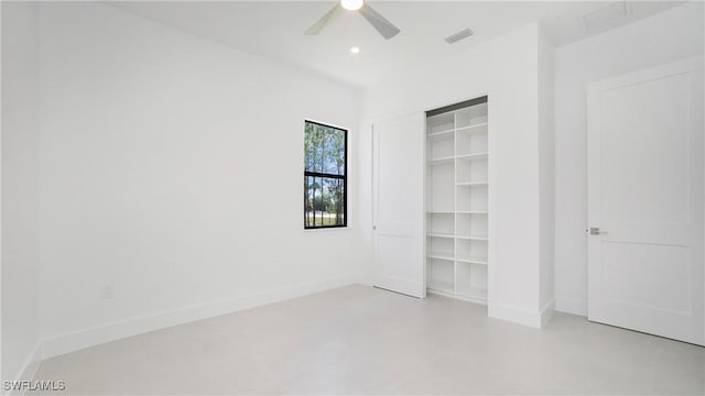 2343 Oil Well Rd, Naples, FL 34120 - unfurnished bedroom with finished concrete floors, a closet, a ceiling fan, visible vents, and baseboards