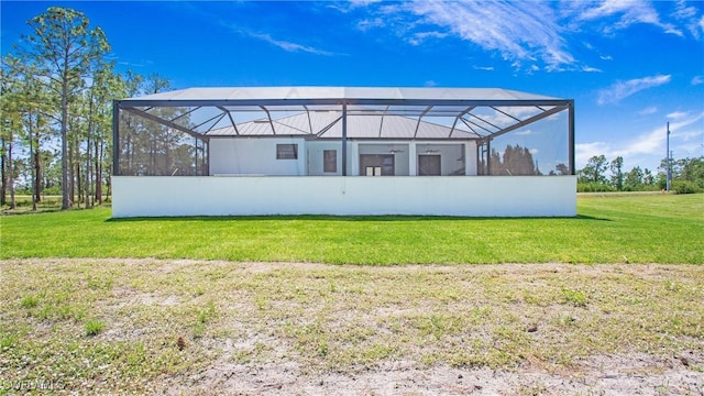 2343 Oil Well Rd, Naples, FL 34120 - rear view of property with a yard and glass enclosure
