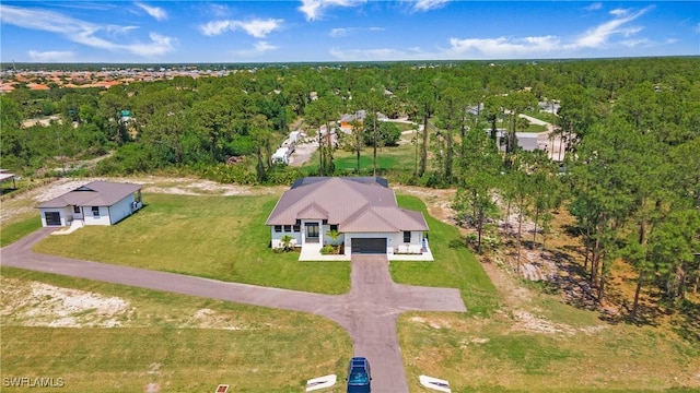 2343 Oil Well Rd, Naples, FL 34120 - drone / aerial view with a wooded view