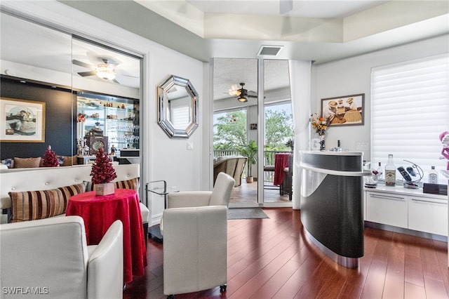 14270 Royal Harbour Ct Unit 323, Fort Myers, FL 33908 - living area with ceiling fan and dark wood-style flooring