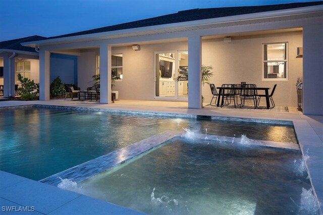 pool featuring a patio and a jacuzzi