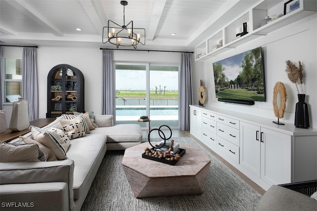living area with wood finished floors, recessed lighting, beam ceiling, and a notable chandelier