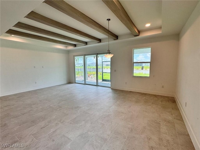 16325 Preservation Blvd, Punta Gorda, FL 33982 - unfurnished room with beamed ceiling, healthy amount of natural light, baseboards, and stone finish floors