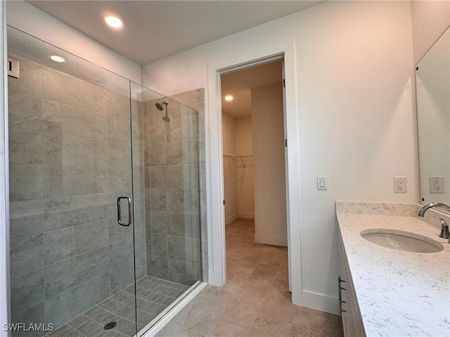 16325 Preservation Blvd, Punta Gorda, FL 33982 - full bath with vanity, a stall shower, recessed lighting, a spacious closet, and tile patterned floors