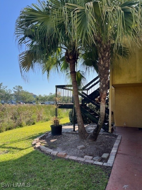 view of yard featuring stairway