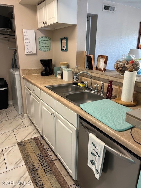 kitchen featuring visible vents, dishwasher, a sink, white cabinetry, and marble finish floor
