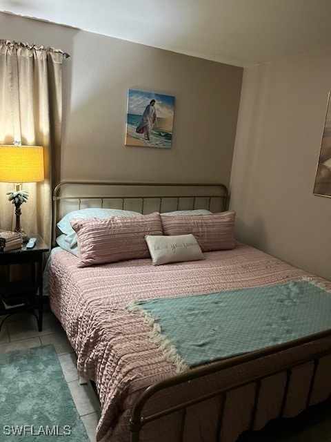 bedroom featuring light tile patterned floors