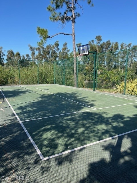 view of sport court featuring community basketball court and fence