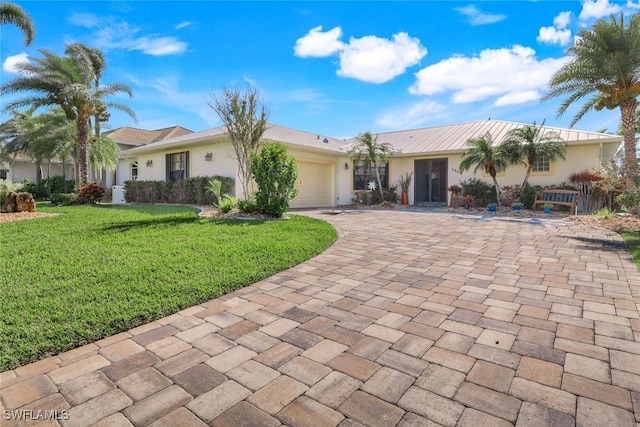 2556 SW 28th Pl, Cape Coral, FL 33914 - ranch-style house featuring an attached garage, stucco siding, driveway, and a front lawn