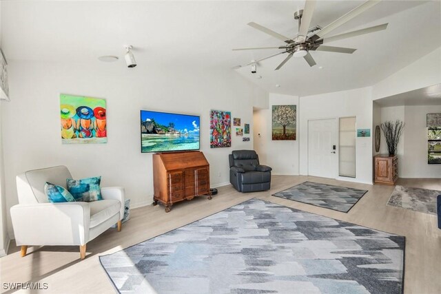 2556 SW 28th Pl, Cape Coral, FL 33914 - living room featuring wood finished floors, baseboards, ceiling fan, and lofted ceiling