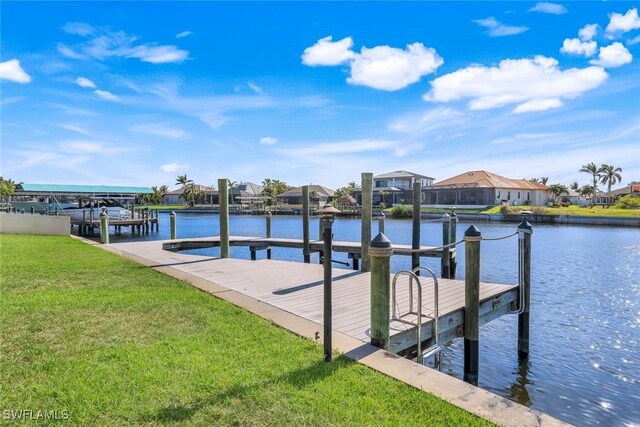 2556 SW 28th Pl, Cape Coral, FL 33914 - dock area with a residential view, a water view, and a yard