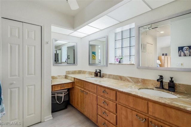 2556 SW 28th Pl, Cape Coral, FL 33914 - bathroom featuring double vanity, ceiling fan, and a sink