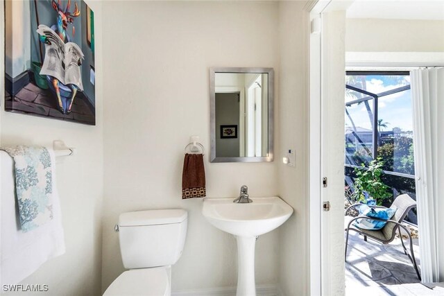 2556 SW 28th Pl, Cape Coral, FL 33914 - bathroom featuring a sink and toilet