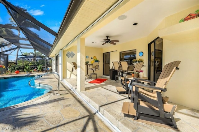 2556 SW 28th Pl, Cape Coral, FL 33914 - outdoor pool featuring a ceiling fan, a patio, and glass enclosure