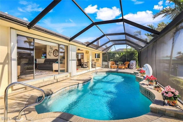 2556 SW 28th Pl, Cape Coral, FL 33914 - pool with glass enclosure, a patio, and a ceiling fan