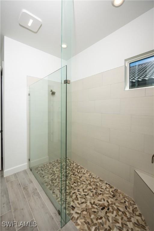 17554 Terracina Dr, Fort Myers, FL 33913 - full bath featuring a shower stall and wood finished floors