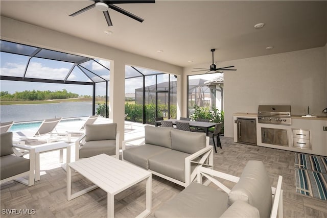 17554 Terracina Dr, Fort Myers, FL 33913 - view of patio featuring area for grilling, an outdoor kitchen, outdoor lounge area, a ceiling fan, and a lanai