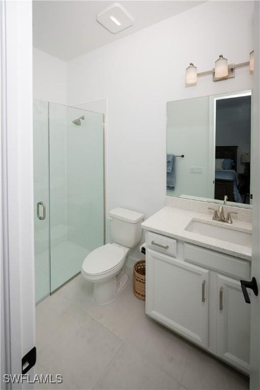 17554 Terracina Dr, Fort Myers, FL 33913 - ensuite bathroom featuring toilet, a stall shower, vanity, and tile patterned flooring