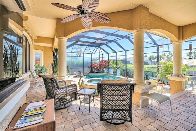 4536 SW 12th Pl, Cape Coral, FL 33914 - view of patio / terrace with a lanai, ceiling fan, and an in ground hot tub