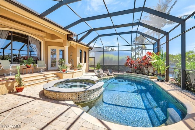 4536 SW 12th Pl, Cape Coral, FL 33914 - view of swimming pool featuring a patio, french doors, a pool with connected hot tub, and glass enclosure