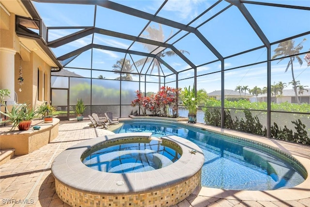4536 SW 12th Pl, Cape Coral, FL 33914 - view of pool featuring a pool with connected hot tub, a patio, and a lanai