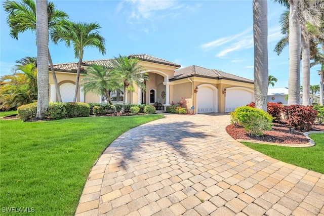 4536 SW 12th Pl, Cape Coral, FL 33914 - mediterranean / spanish-style home with stucco siding, a front lawn, and a tile roof