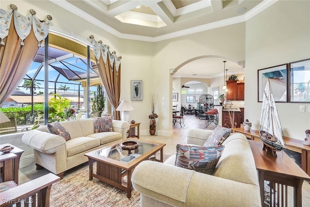 4536 SW 12th Pl, Cape Coral, FL 33914 - living area with baseboards, a high ceiling, crown molding, coffered ceiling, and arched walkways