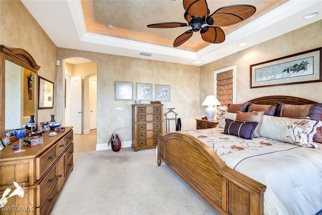 4536 SW 12th Pl, Cape Coral, FL 33914 - bedroom with baseboards, visible vents, a tray ceiling, arched walkways, and light colored carpet