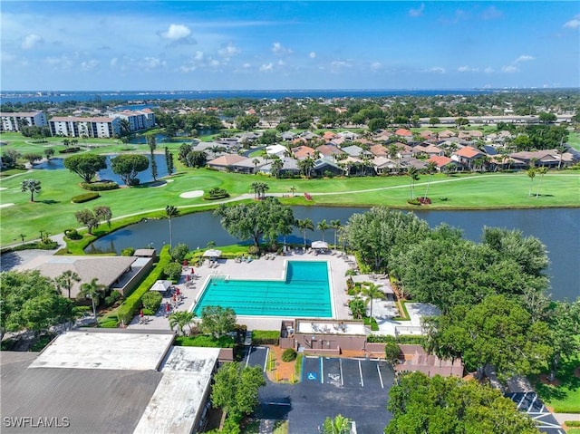 bird's eye view with a water view and view of golf course