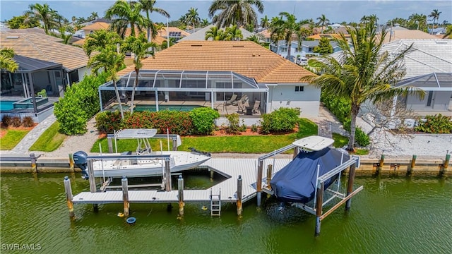 1633 Barbarosa Ct, Marco Island, FL 34145 - view of dock with an outdoor pool, boat lift, glass enclosure, and a water view