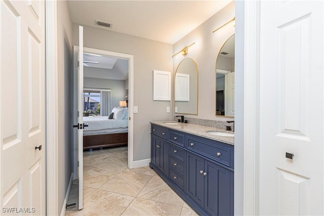 1633 Barbarosa Ct, Marco Island, FL 34145 - ensuite bathroom featuring a sink, visible vents, double vanity, and ensuite bathroom