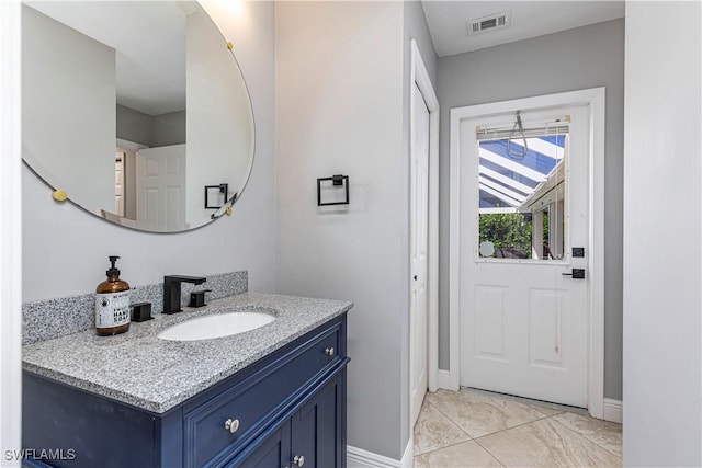 1633 Barbarosa Ct, Marco Island, FL 34145 - bathroom featuring vanity, visible vents, and baseboards