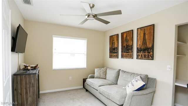 6645 Huntington Lakes Cir Unit 201, Naples, FL 34119 - living room featuring ceiling fan, visible vents, baseboards, and light carpet