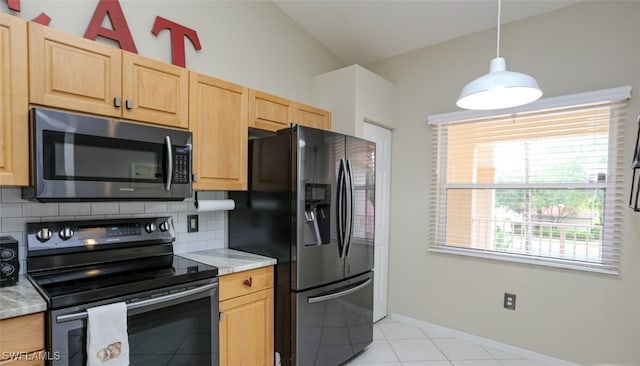 6645 Huntington Lakes Cir Unit 201, Naples, FL 34119 - kitchen with light brown cabinets, refrigerator with ice dispenser, range with electric cooktop, and stainless steel microwave